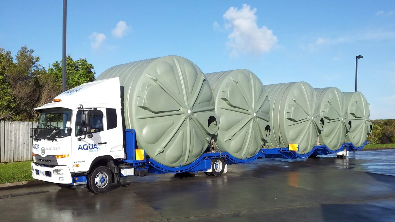 Large water tanks on the truck ready for delivery x4
